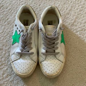 white and green star sneakers